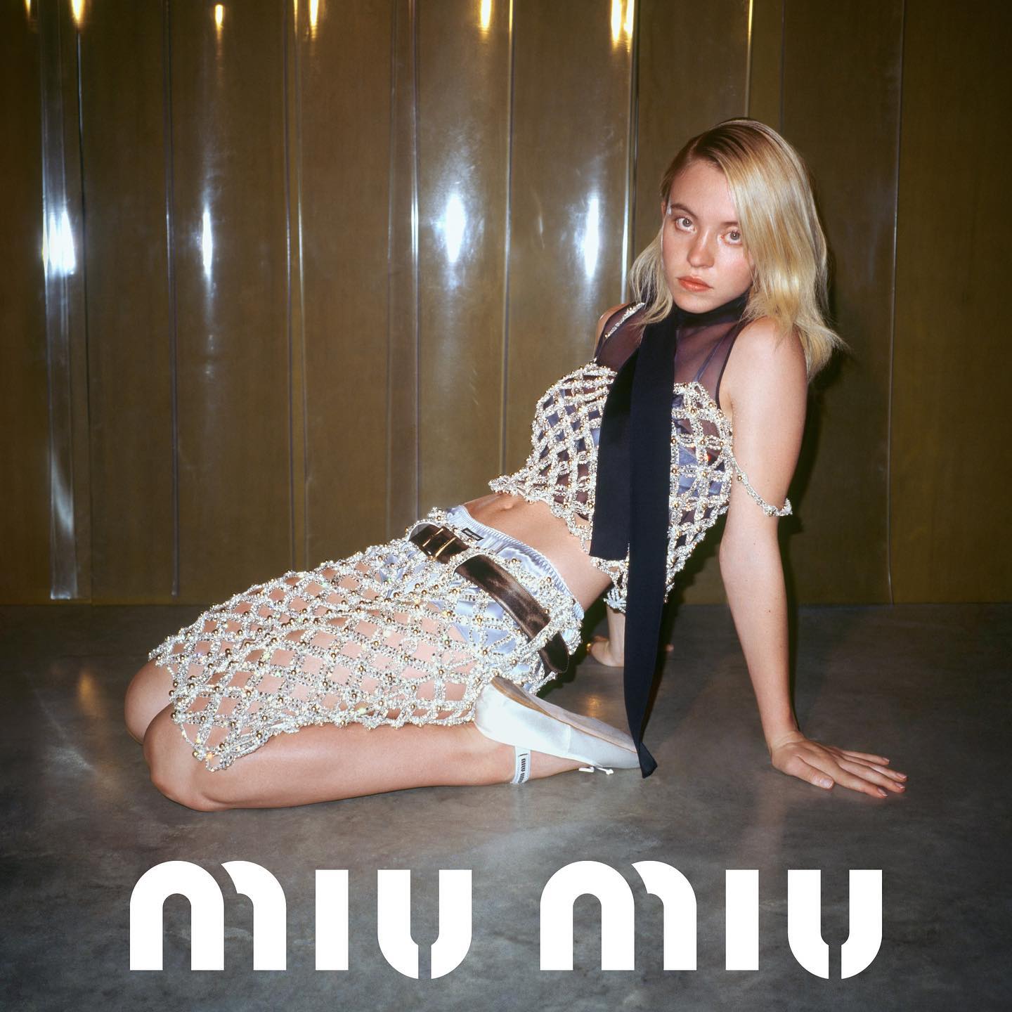 Sydney Sweeney smiles nude